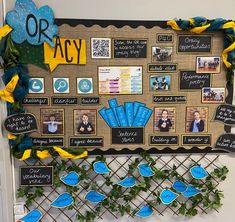 a bulletin board decorated with blue and yellow decorations