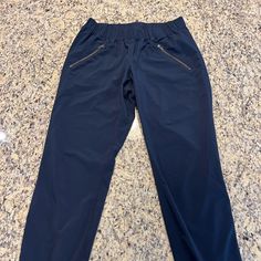 Nwot Athleta Navy Joggers With Zip Pockets. Unique Scrunching Detail Down The Sides! Beautiful Color And Soft Material. Size: 2 Stretch Sports Joggers With Pull-on Style, Navy Athleisure Pants For Gym, Navy Athleisure Pants For The Gym, Navy Athleisure Pants For Sports, Stretch Navy Activewear With Pockets, Navy Stretch Activewear With Pockets, Navy Stretch Activewear With Elastic Waistband, Navy Athleisure Pants For Jogging, Navy Sports Pants With Elastic Waistband