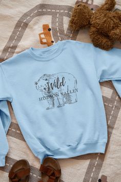 Calling all fashion-forward folks who want to show off their love for the Hudson Valley! This Wild Bear Hudson Valley New York Cute Graphic Crewneck Sweatshirt is a must-have addition to your wardrobe. The sweatshirt is made by Gildan and is not only super stylish, but also incredibly comfortable, cozy, and warm. Whether you're snuggled up on the couch, running errands around town, or hitting the trails, this sweatshirt will keep you looking and feeling great. So don't wait - grab yours today and show the world your love for the Hudson Valley in style! * 50% cotton, 50% polyester * Pre-shrunk * Classic fit * 1x1 athletic rib knit collar with spandex * Air-jet spun yarn with a soft feel and reduced pilling * Double-needle stitched collar, shoulders, armholes, cuffs, and hem Nike Inspired, Wild Bear, Hudson Valley New York, Donut Shirt, Pokemon T, Nike Shirt, Sweatshirt For Women, Nike Tshirt, Nike Shirts