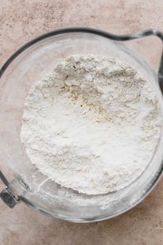 a blender filled with flour on top of a counter