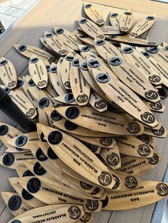 several wooden paddles are arranged on a table