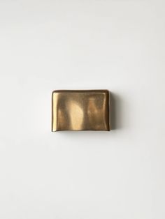 a gold rectangular object on a white background with space for text or an image to be used as a brochure