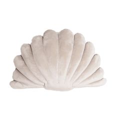 a white scallop shell shaped pillow on a white background with the bottom half open