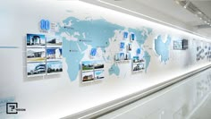 a white wall with blue and black pictures on it's sides, along with a map of the world