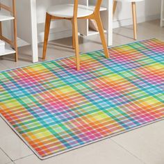 a multicolored rug in the middle of a room with chairs and desks