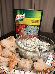 a plate topped with bread and dip next to a box of knorr vegetables