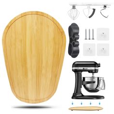 an electric mixer and wooden cutting board with attachments for the kitchen appliance