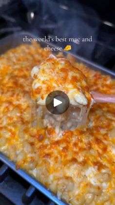 a pan filled with food cooking on top of an oven