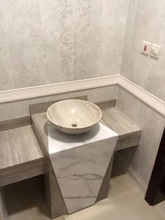 a white sink sitting on top of a counter in a bathroom