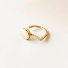 Golden Disc Adjustable Ring for Women made of Matte Brass:  Avant Garde Bauhaus Jewelry. This Bauhaus inspired ring is a geometric midi ring easy to wear every day. An avant garde ring that is the best compliment for all your outfits. It was handmade in my workshop in Madrid. The diameter of the brass circle is 1 cm and is placed asymmetrically on the ring. The band is made of square section wire. The brass finish is matte. Please, choose from available sizes on ordering.  The ring is available Bauhaus Jewelry, Architect Gift, Bauhaus Inspired, Midi Ring, Midi Rings, Minimalist Ring, Modern Gift, Minimalist Rings, Contemporary Jewelry