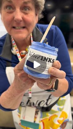 an older woman holding a jar of ice cream