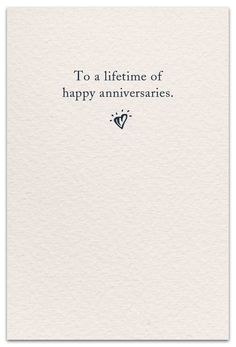 a white card with the words to a life time of happy annivers on it