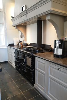 a kitchen with an oven, stove and counter top