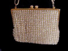 "EASY LAYAWAY IS AVAILABLE A gorgeous all rhinestone evening bag hand made in Hong Kong from the early '60s The prong-set sparkling rhinestones are set on a background of twisted gold metallic threads which makes for a stunning combination - today's rhinestones do not compare to the sparkle and intensity of vintage rhinestones - the clasp is 2 huge rhinestones which are just gorgeous There is a gold satin lining with a small pocket for a mirror or some money - there is some light soiling on the Crystal Embellished Evening Bag For Gift, Victorian Rectangular Evening Bag For Party, Victorian Rectangular Party Bag, Elegant Handmade Evening Bag For Celebration, Elegant Rhinestone Evening Bag As Gift, Gold Sparkling Bag As Gift, Elegant Rhinestone Evening Bag, Gold Sparkling Bag For Gift, Elegant Evening Bag With Rhinestones For Gifts