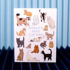 a card with cats on it that says world's best cat dad