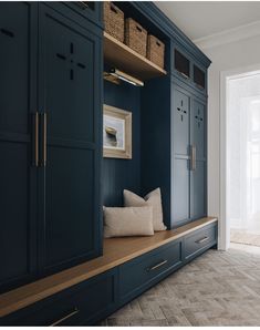 a room with blue cabinets and white walls