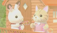 an animated image of two cats and a bunny in front of a wooden fence with bubbles