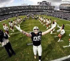 a football player is celebrating on the field