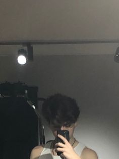 a person taking a selfie in front of a mirror