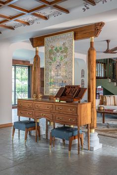 a large wooden desk sitting in the middle of a living room