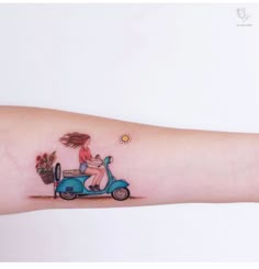 a woman riding on the back of a blue scooter with potted plants