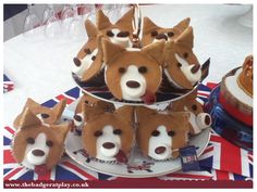 some cupcakes that have been made to look like dogs on top of each other