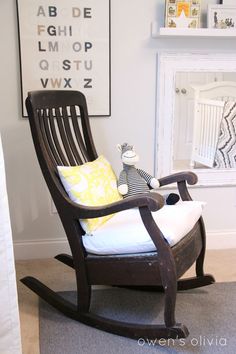 a rocking chair with a stuffed animal on it