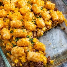 a casserole dish with tater tots and corn