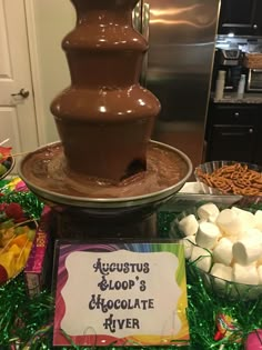 there is a chocolate fountain with marshmallows on it