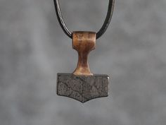 ▪️ Chain or cord is not included. You can purchase leather cord here: https://www.etsy.com/listing/1284872085 ▪️ 26 mm high, 20 mm wide  ▪️ hole diameter: 4 mm ▪️ weight: approx. 6 g This Mjolnir pendant pays homage to the legendary Mjolnir, known as the Hammer of Thor, the powerful Norse god associated with thunder and protection. The Hammer's handle is available in your choice of either silver or bronze, both treated with a patina to give it an aged and authentic appearance. The true highlight of the pendant is the hand-carved hematite stone at its core. As a subtle mark of authenticity, our workshop logo graces one side of the pendant. M e t a p h y s i c a l * P r o p e r t i e s Hematite is a powerful stone known to improve memory and stimulate deep, analytical thinking. It's particul Mental Organization, Hammer Necklace, Hammer Of Thor, Hammer Handles, Mjolnir Pendant, Hammered Necklace, Thor Hammer, Vikings Gifts, Viking Culture