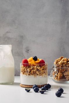 an image of granola with fruit and milk