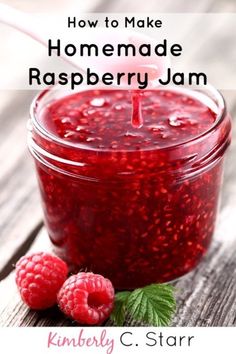 homemade raspberry jam in a jar with fresh raspberries