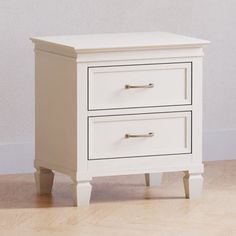 a white nightstand with two drawers on the bottom and one drawer open to reveal something