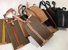 five different colored bags with zippers on them