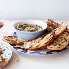 grilled cheese sticks with dip and crackers on a blue and white patterned plate