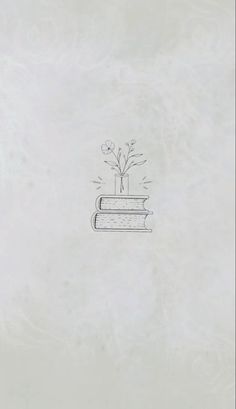 a drawing of a plant on top of a book