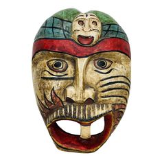 a wooden mask with a red hat on it's head and an open mouth