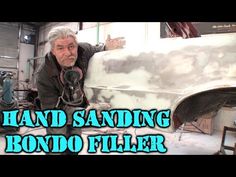 an old man is sanding down a bondo filler in his garage with the words, hand sanding rondo filler