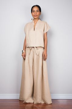 "Linen pants, Handmade natural linen long wide leg palazzo pants. Beige brown high waist women's summer pants Made with the highest care this beautifully crafted garment will fit you perfect thanks to the elastic strap on the back. I like wearing this one when sitting in the garden reading a book and dream away. Soul of the Orient Collection - Original Design & Produced by NUICHAN PRODUCT SIZE : One Size Fits Most * Waist : elastic round waistband up to 26 - 38\" * Hips : (max 40\") if your Elegant Beige Wide Leg Pants For Summer, Summer High-waisted Wide Leg Pants In Neutral Color, Elegant Neutral Wide Leg Pants For Summer, Spring Wide-leg Flax Pants, Elegant Brown Wide Leg Summer Pants, Beige Flax Pants For Summer, Bohemian Beige Linen Pants, Wide Leg Flax Pants For Summer, Brown Linen Relaxed Fit Wide Leg Pants