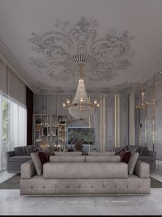 an elegant living room with chandelier and couches