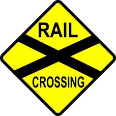 a railroad crossing sign with the word rail crossing written in black and yellow on it