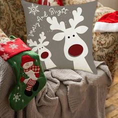 a christmas pillow sitting on top of a chair