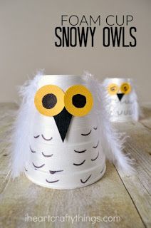 paper cup snow owls with white feathers and yellow eyes