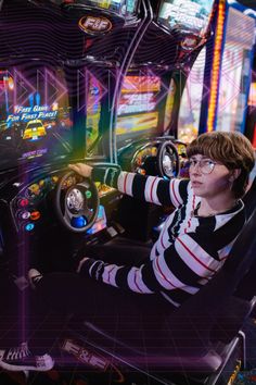 a person sitting in a chair with a steering wheel