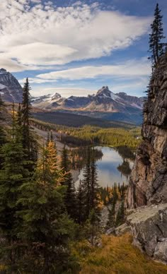 a mountain lake surrounded by trees and mountains