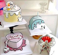 there are many cakes on the shelves in this room, each decorated with different designs