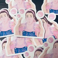 several stickers with the image of a woman brushing her hair