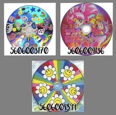 three cd's with different designs and numbers on the front, one for each disc