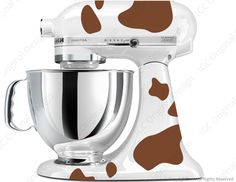 a white and black cow print mixer