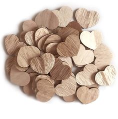 wooden hearts are arranged on top of each other